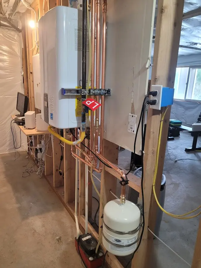 Licensed plumber repairing a kitchen sink in Mead