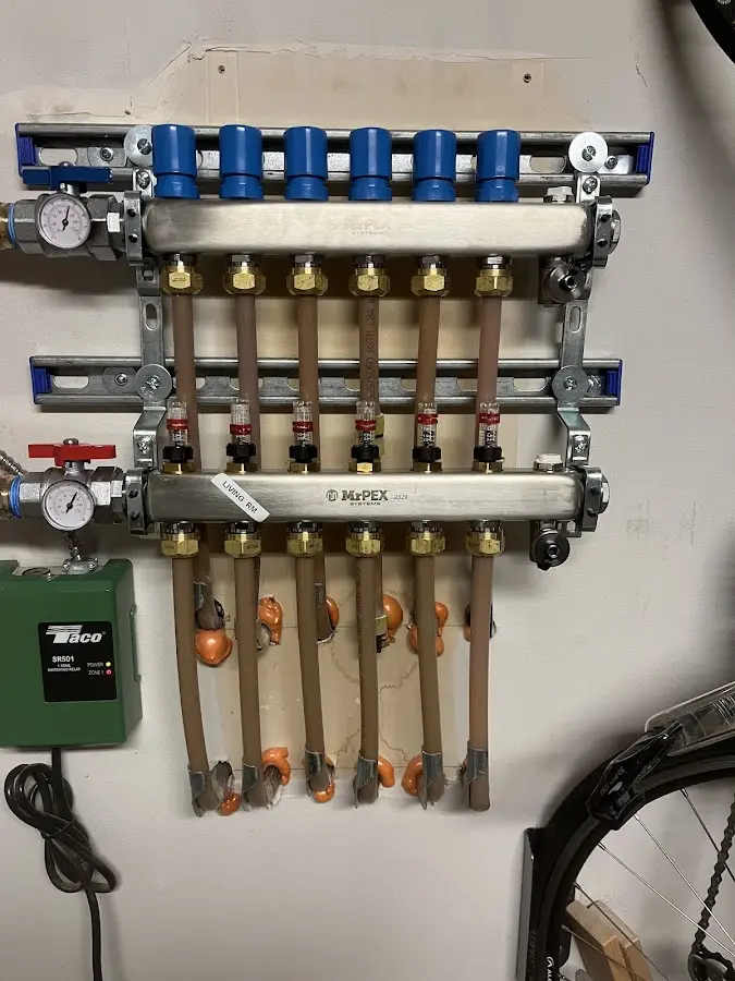 Plumber performing Water Heater Repair at a residential property in Mead